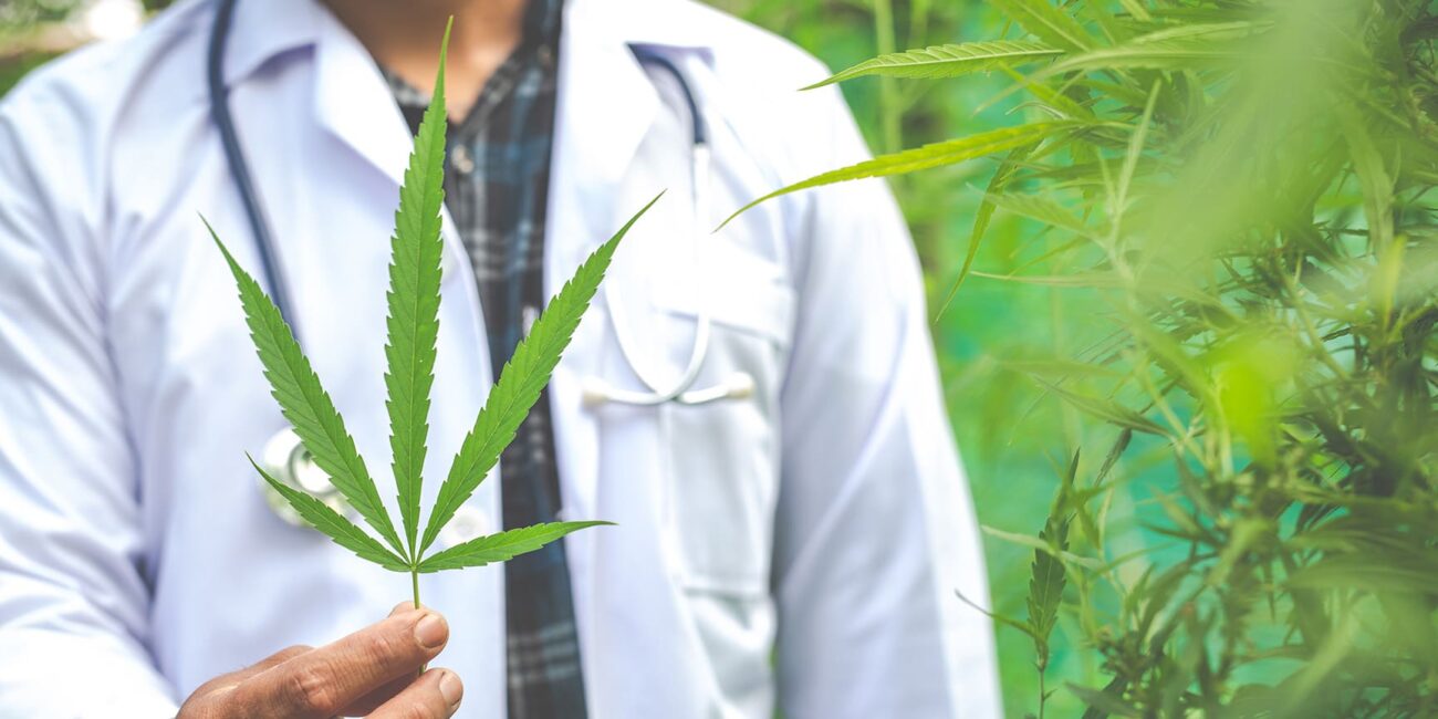 Can you be allergic to weed?
A man in a medical gown holds cannabis leaves