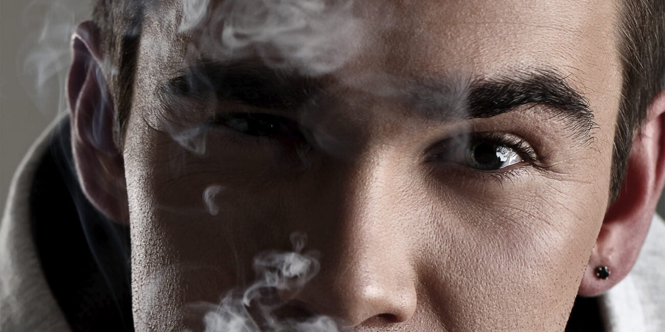 person's face and a smoke