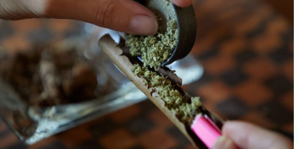 Are Blunts Harsher Than Joints? Multiple joints and blunts lined up on a wooden surface