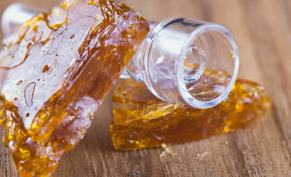 What Is Live Resin Sugar? Freshly frozen cannabis flower in a container, covered in frost, prepared for Live Resin Sugar extraction.