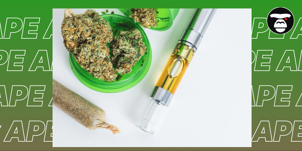 Flat lay of cannabis flower nugs in a green container, a vape oil cartridge, and a pre-rolled joint.