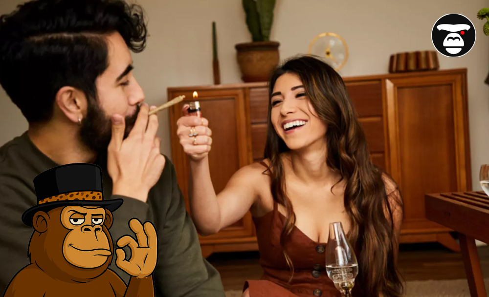 A smiling woman lighting a cannabis joint for a man in a cozy indoor setting.