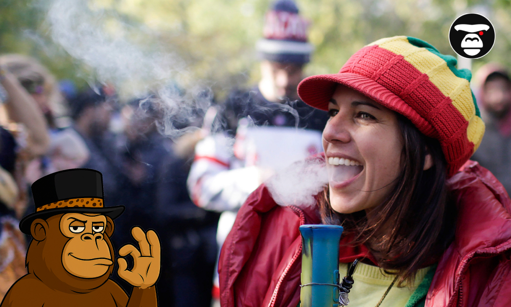 Best Strains for Social Gatherings A woman in a red jacket and Rasta-colored hat exhaling smoke from a bong.